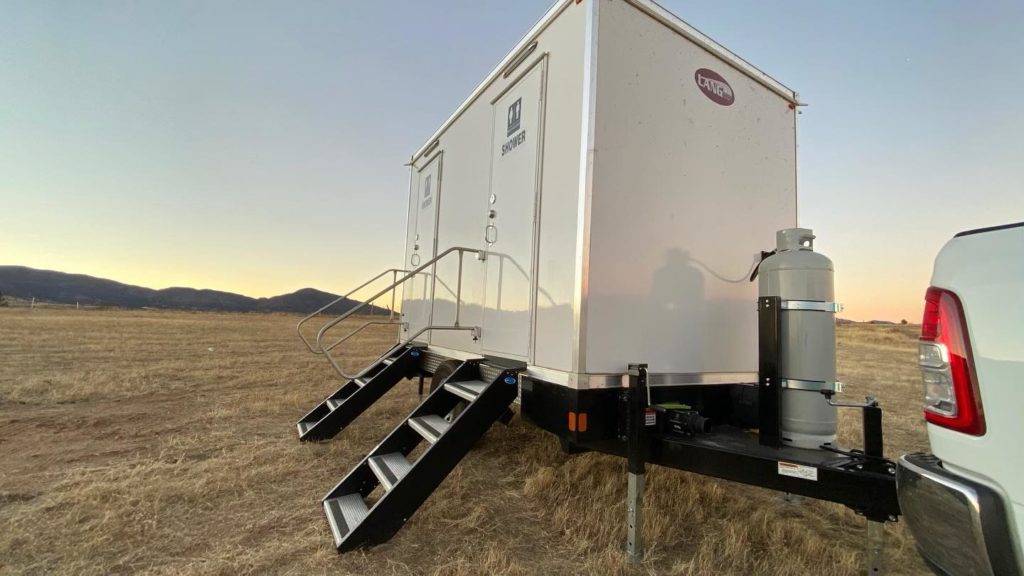 The Lavatory Utah 2 Stall Shower Trailer in Desert - Outdoor View